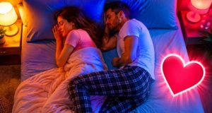 What It Means When Your Partner Sleeps With One Leg Over Yours